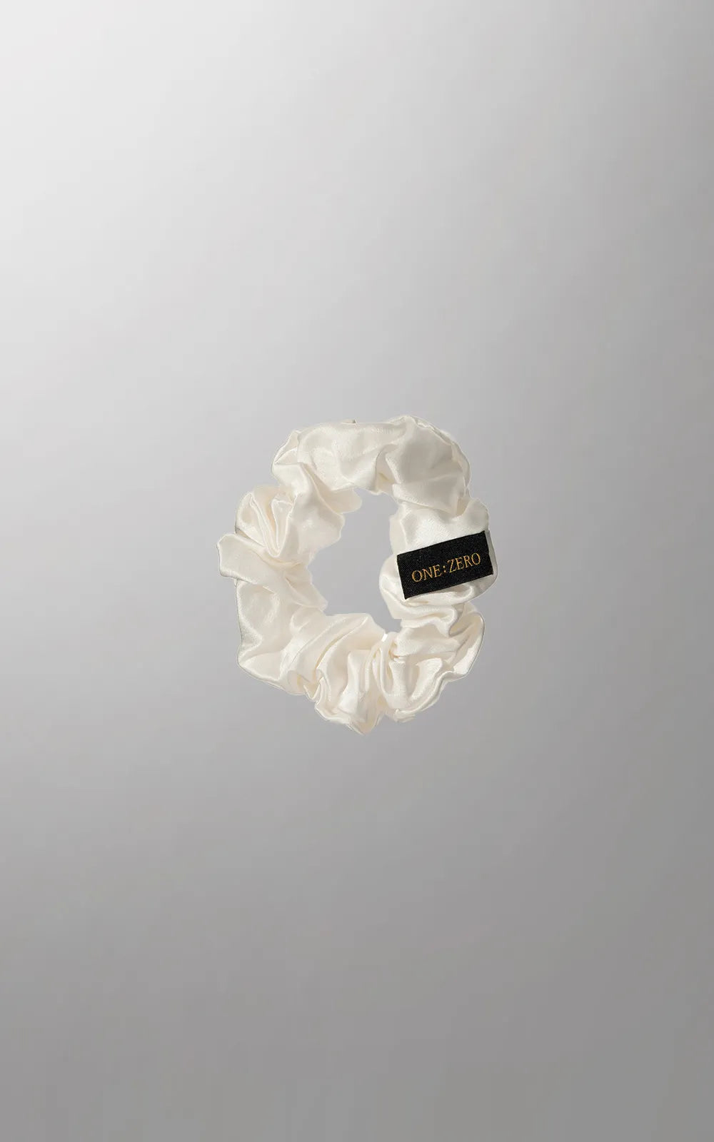Set of Burgundy Clover silk hair ties in gray, golden, and white in medium and large sizes, perfect for hair accessories.