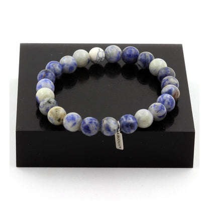 Tan Coconut Sodalite and Howlite bracelet with 8 mm beads, featuring blue and white stone beads on an elastic cord.