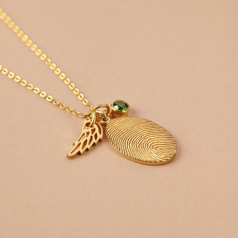 Green Millie fingerprint necklace with personalized fingerprint engraving and a sparkling birthstone pendant.