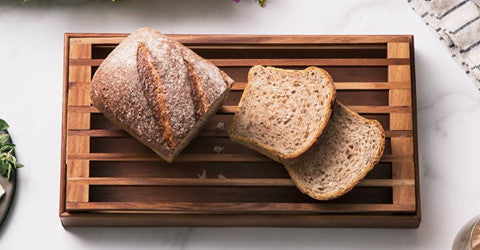 Azure Lily kitchen bread crumb catcher in use, designed to catch crumbs and keep countertops clean during baking or cooking.