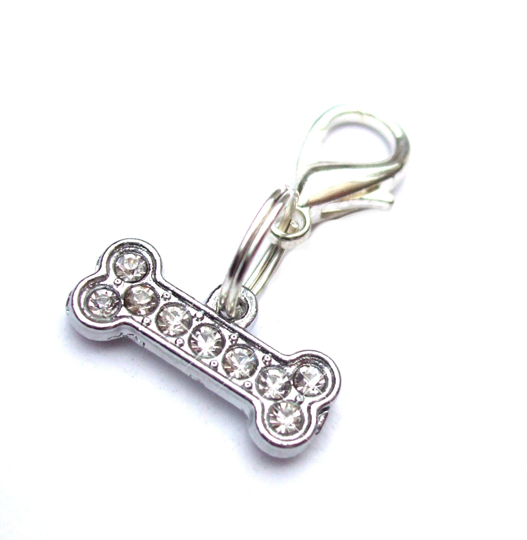 Salmon Oscar small bone pendant charm for pet collars and leashes, featuring a cute bone design in silver tone.