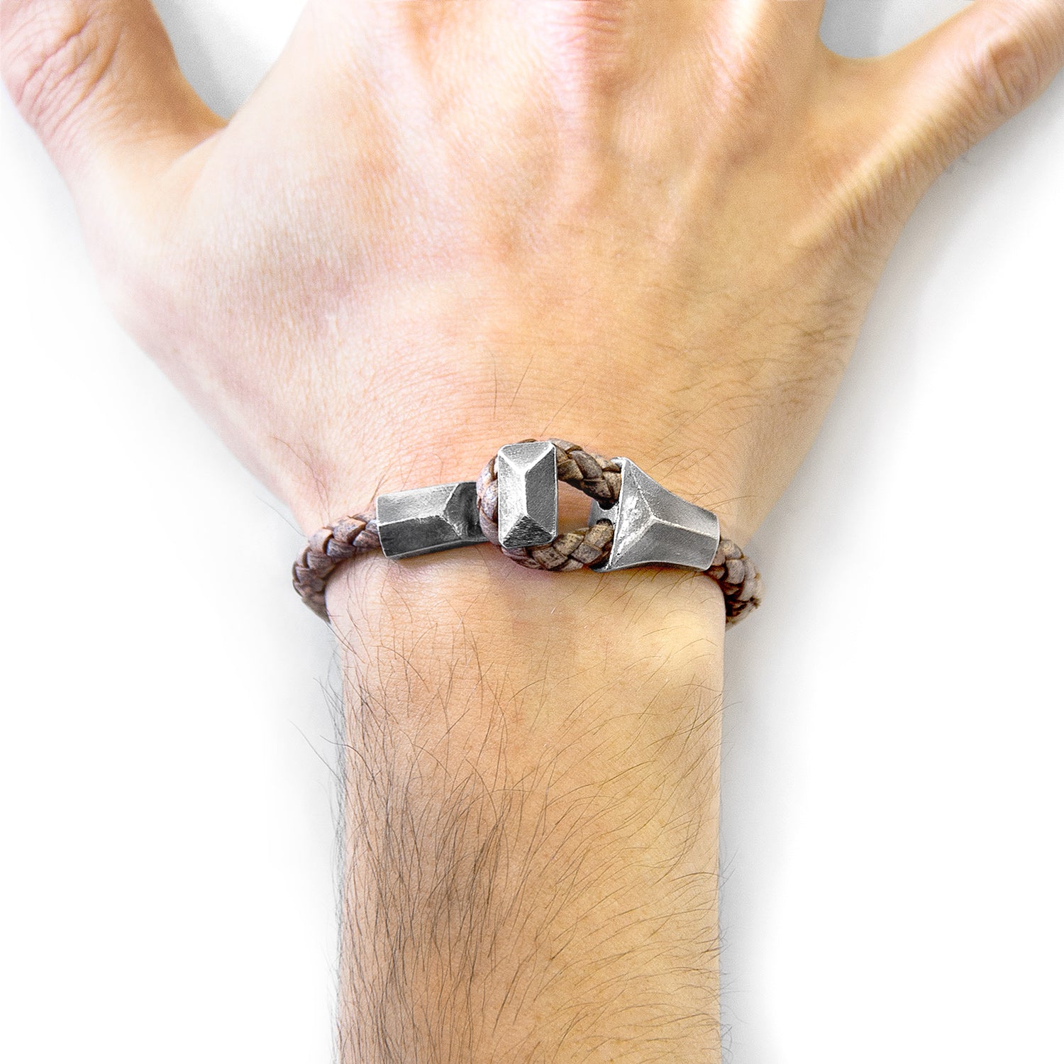 Taupe grey Alderney silver and braided leather bracelet by Magenta Sooty, featuring a sleek silver clasp and woven leather design.