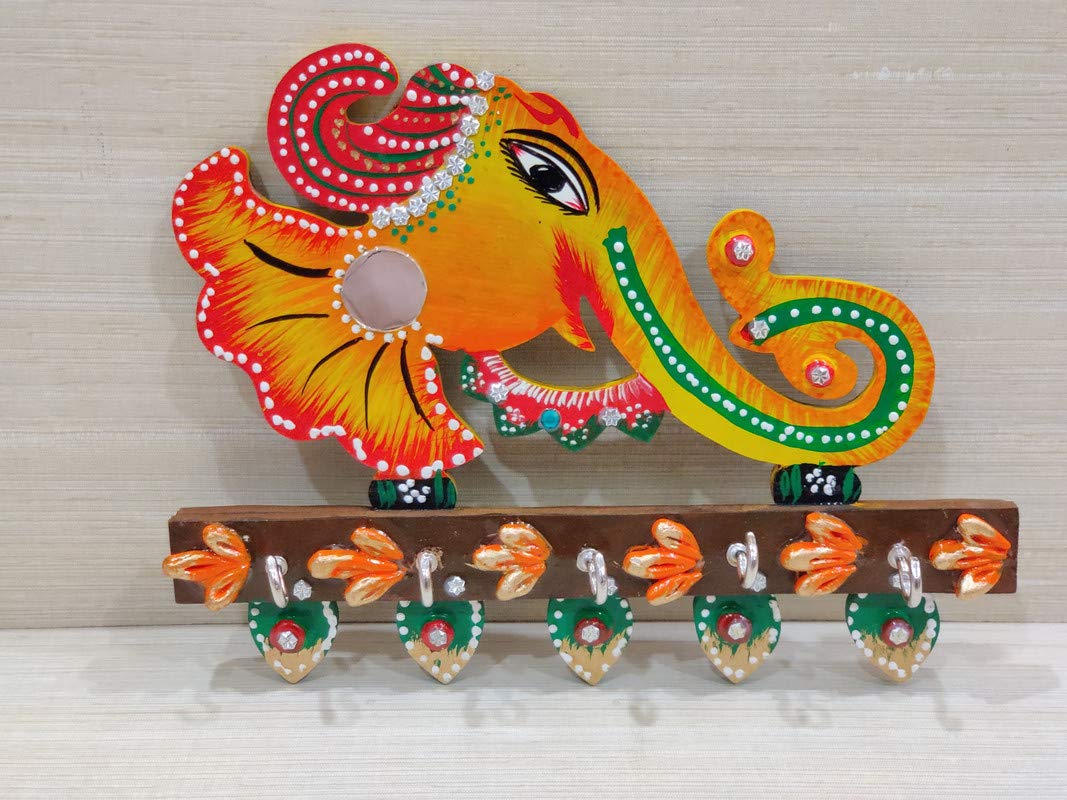 Wooden Ganesha wall hanging with key holder for home decor, featuring intricate design and handcrafted details from Harlequin Hermes.