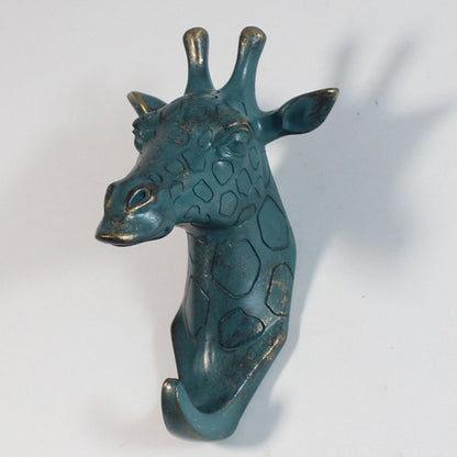 Fuchsia Molly resin giraffe head wall hook for home and garden décor, featuring a detailed giraffe design and sturdy mounting.