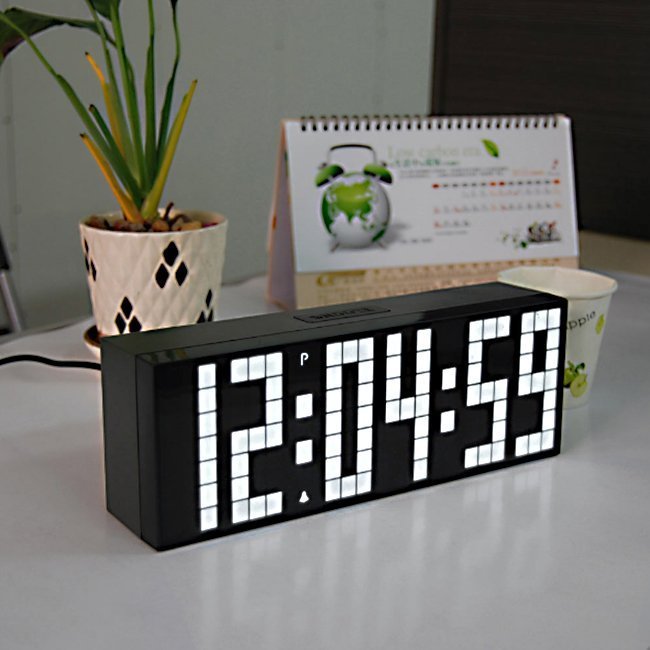 Fuchsia Molly Home LED Digital Clock displaying time on a sleek black background in a home setting
