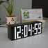 Fuchsia Molly Home LED Digital Clock displaying time on a sleek black background in a home setting