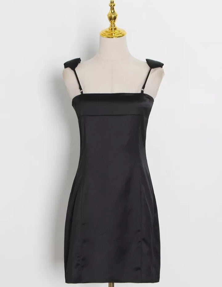 Women’s sleeveless high waist minimalist dress with square collar in solid color by Mauve Ananke, displayed on a mannequin.