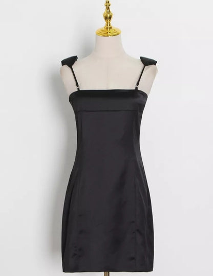 Women’s sleeveless high waist minimalist dress with square collar in solid color by Mauve Ananke, displayed on a mannequin.