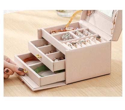 Brown Demeter leather jewelry box for earrings and rings, featuring organized compartments for stylish storage.