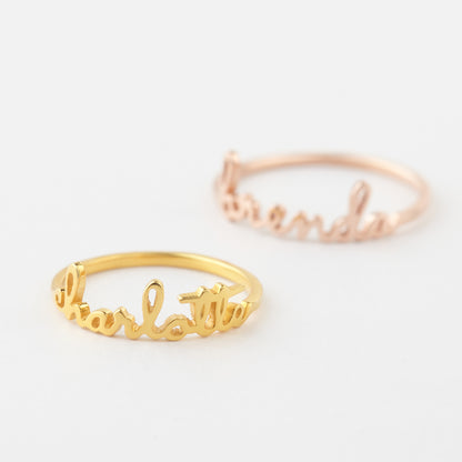 Green Millie stackable name ring, minimalist mom ring with engraved custom name, designed for stacking and everyday wear.