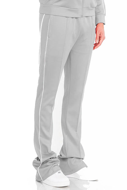 Mens Lime Milo activewear side pipe stacked flare pants hanging on a rack, showcasing their relaxed fit and stylish design.