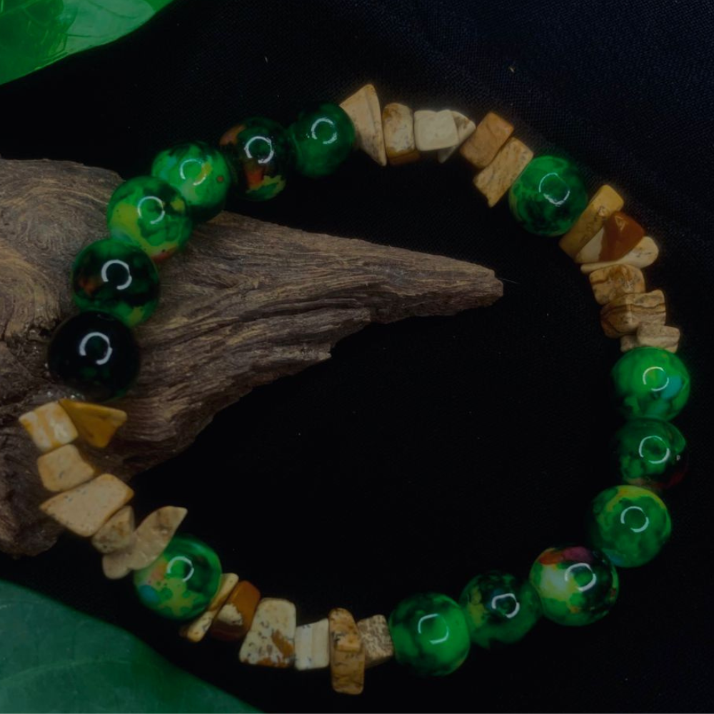 Tan Saffron Bark Agate and Black Green Stone chip stretch bracelet with polished, irregularly shaped beads on elastic band.