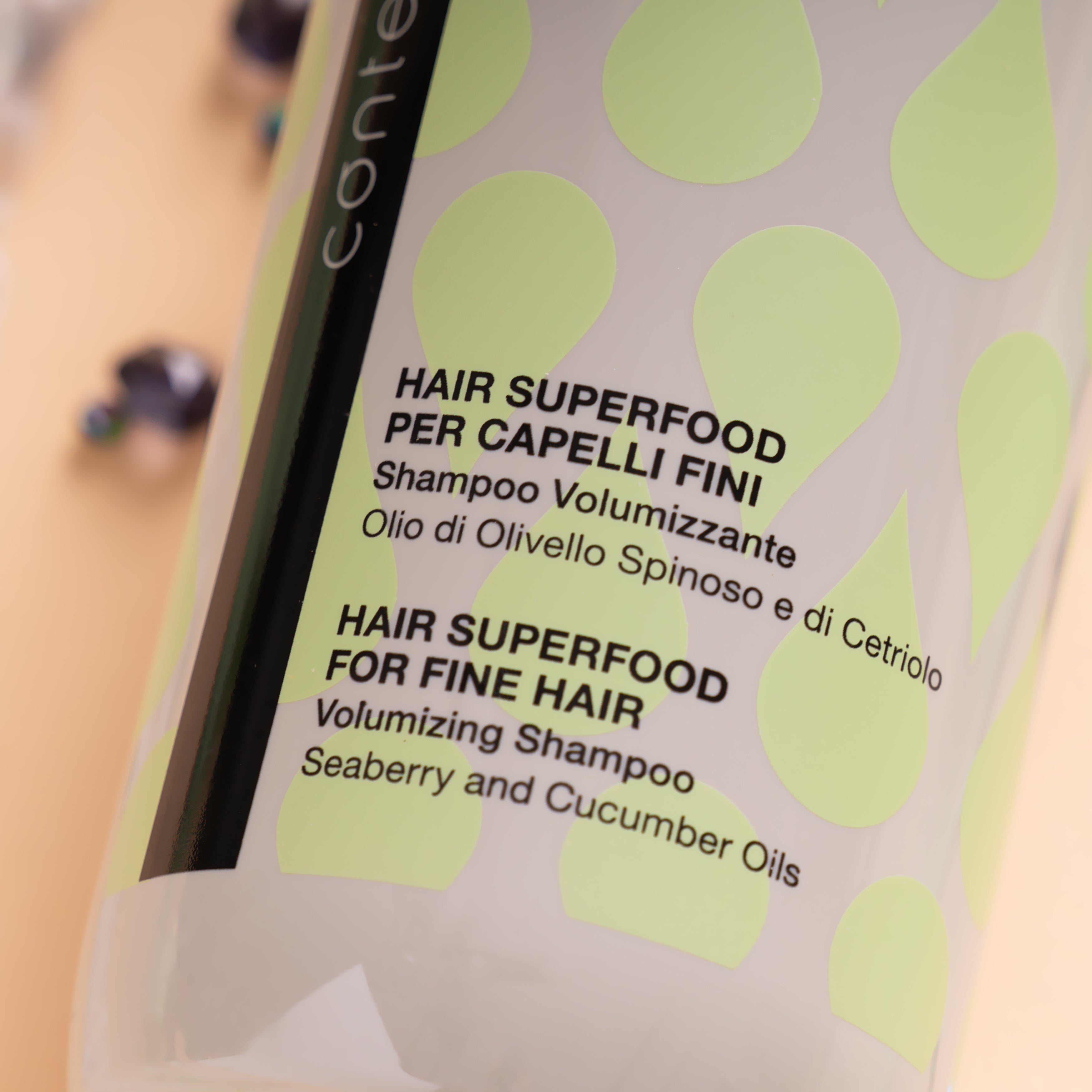 Pink Misty Contempora Volumizing Shampoo for fine hair, showing the sleek bottle and vibrant label on a white background.