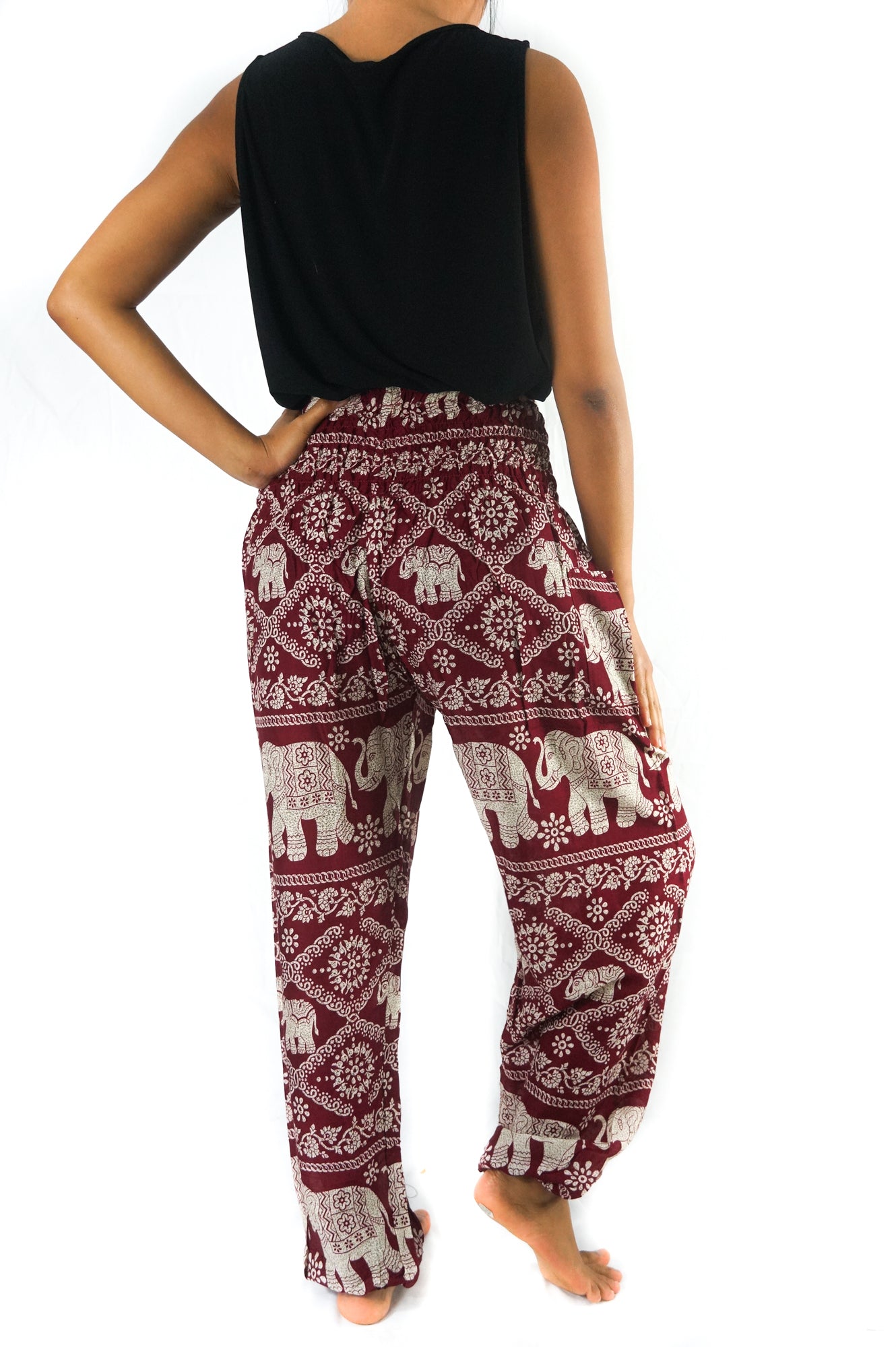 Burgundy Elephant print boho pants for women, Tan Smokey hippie yoga pants with relaxed fit and colorful elephant design.