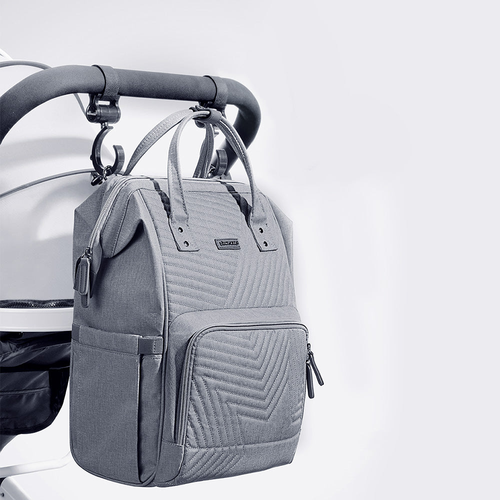Modern quilted diaper bag backpack by Maroon Chronos, stylish kids and babies accessory with multiple pockets and adjustable straps.