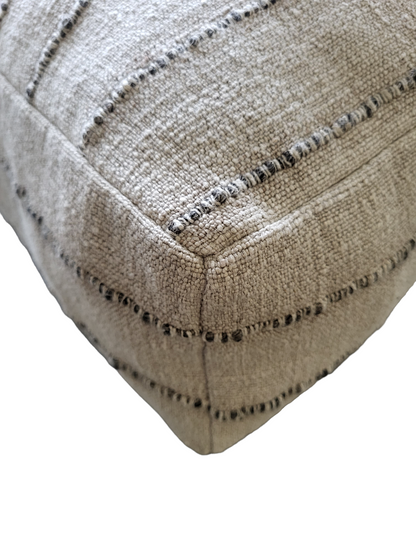 Purple Cassiopeia Nomad floor cushion and pouf with soft fabric and colorful pattern, perfect for lounging and casual seating.