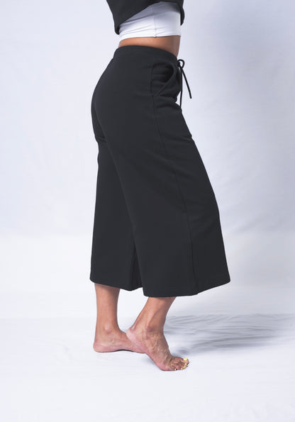 Beige Daisy Colette Pants from matching sets collection, beige fabric with tailored design, front pockets, and high-waisted fit.