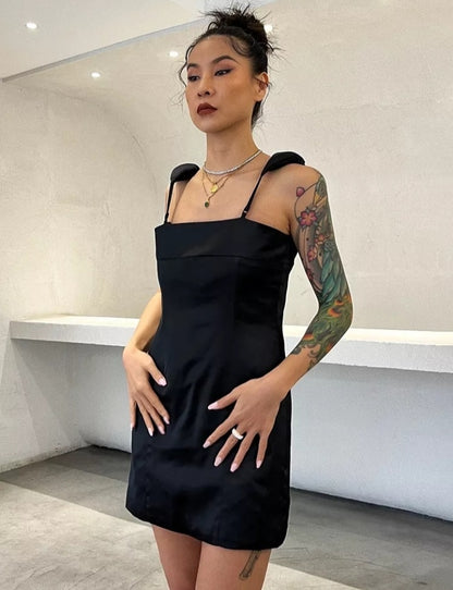 Women’s sleeveless high waist minimalist dress with square collar by Mauve Ananke, solid color, suitable for casual or elegant wear.