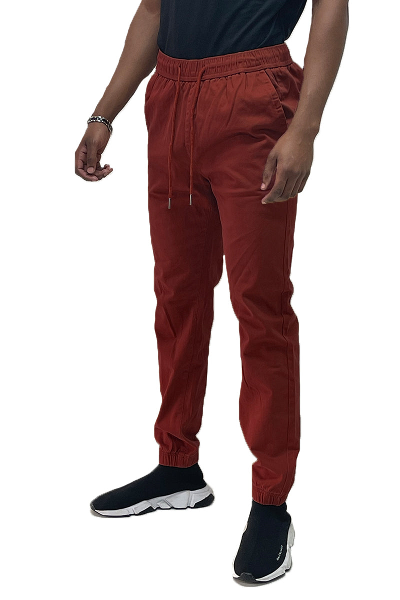Lime Milo Solid Jogger Pants J133 in black, showing the relaxed fit, elastic waistband, and cuffed ankles on a model.