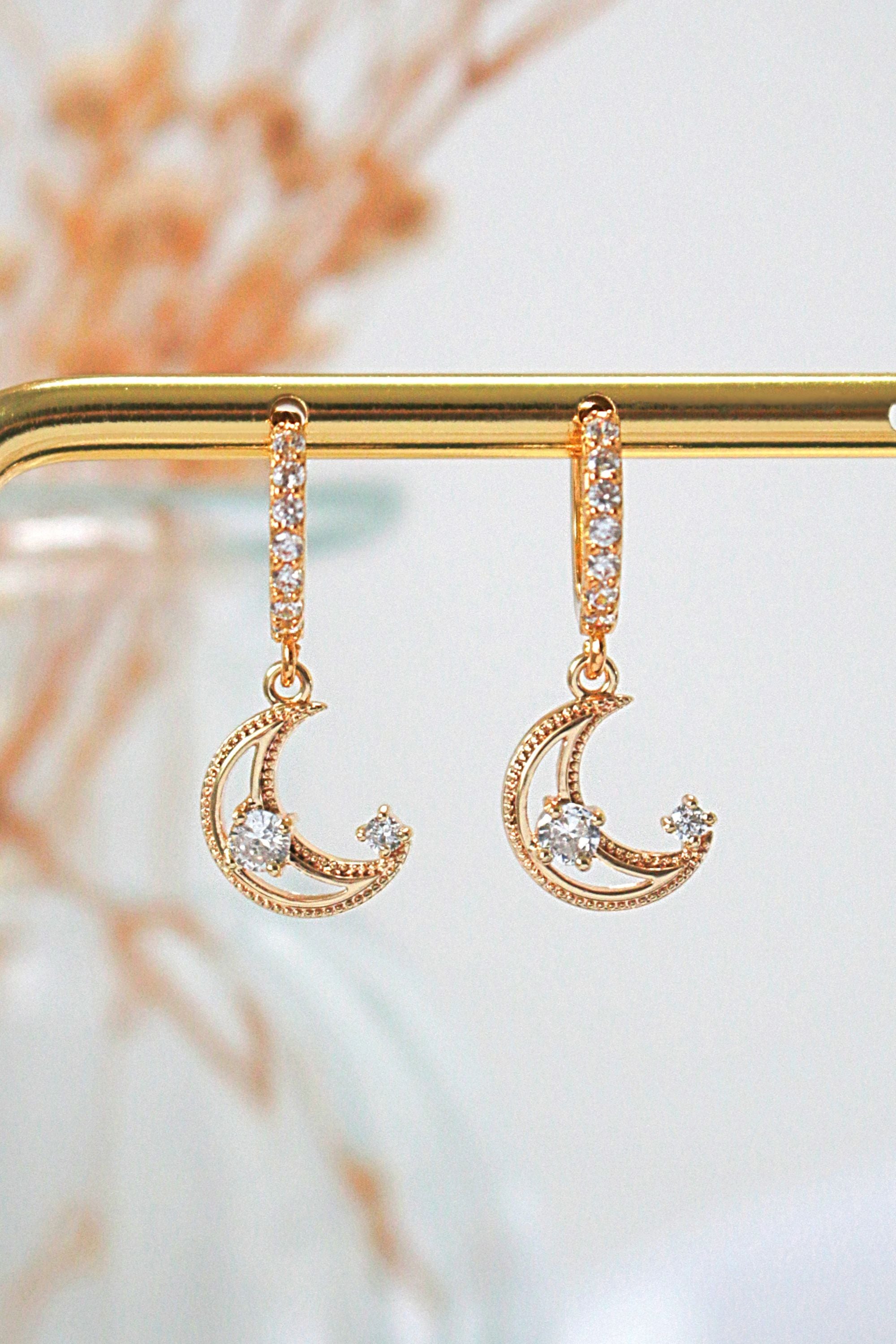 Ultramarine Birch 24 Karats Gold Cubic Zirconia Moon Hoop Earrings, shiny gold hoops with sparkling zirconia accents.