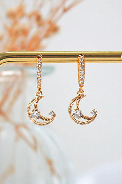 Ultramarine Birch 24 Karats Gold Cubic Zirconia Moon Hoop Earrings, shiny gold hoops with sparkling zirconia accents.