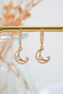 Ultramarine Birch 24 Karats Gold Cubic Zirconia Moon Hoop Earrings, shiny gold hoops with sparkling zirconia accents.