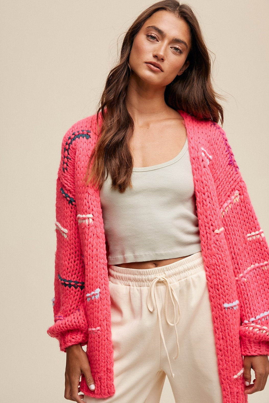 Hand-crochet boho open-front chunky cardigan sweater by Champagne Erebus with a loose fit and intricate knit pattern.