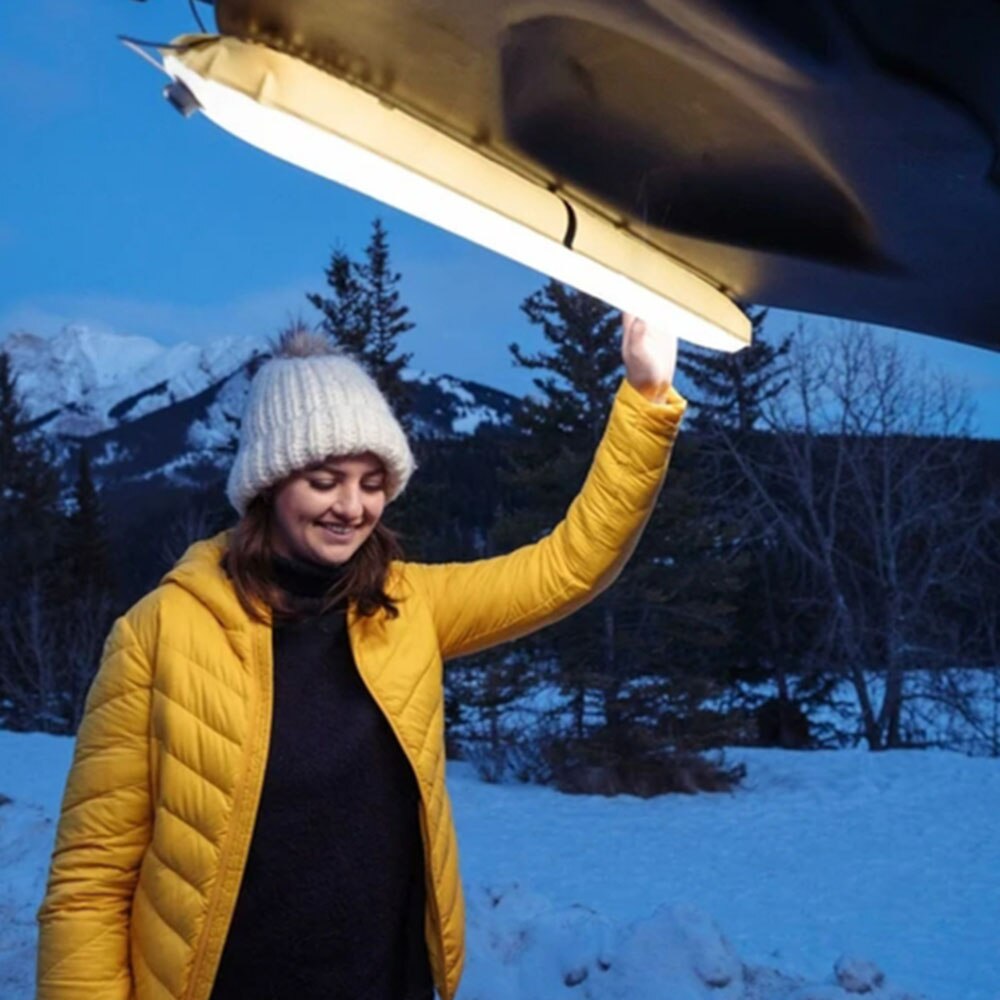 Teal Simba portable inflatable camping lamp emitting bright light, ideal for outdoor camping and outdoor sports activities.