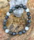 Blue flash Labradorite and rainbow moonstone stretch bracelet by Violet Chaos featuring vibrant, iridescent gemstone beads.