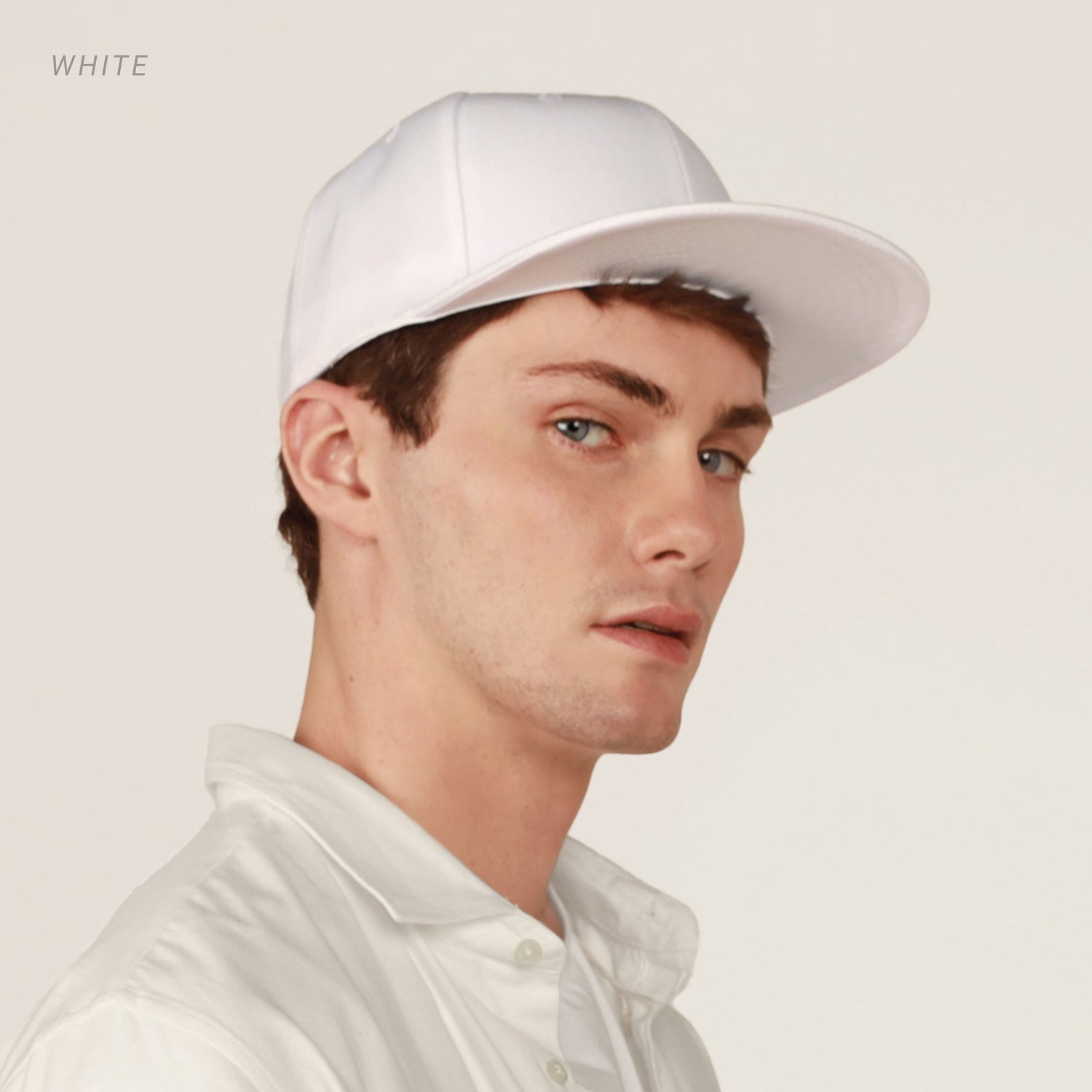 Crimson Hector classic flat bill snapback hat with adjustable polyester fit and breathable fabric, shown from the front view.