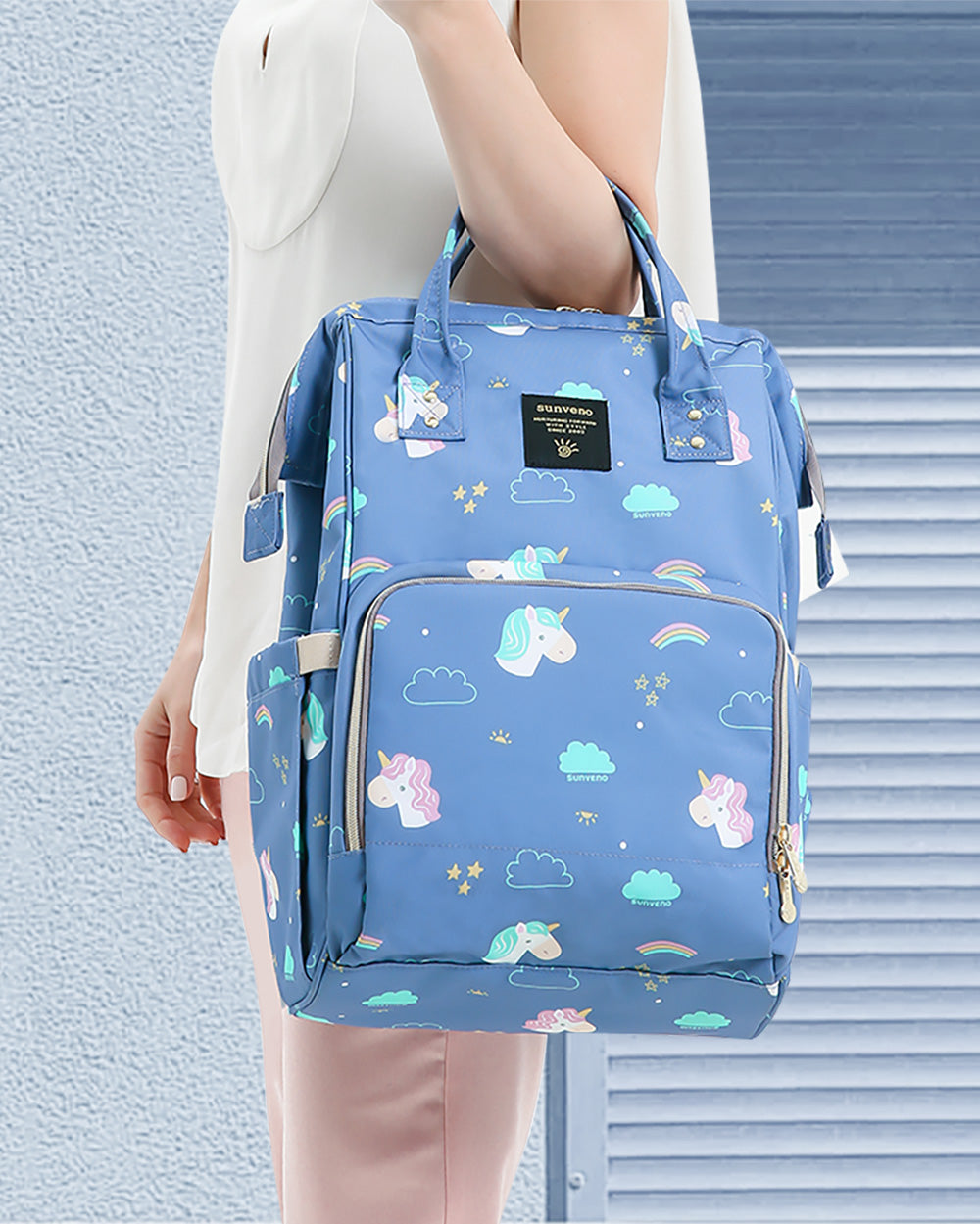 Maroon Chronos fish-opening diaper bag unicorn backpack with multiple compartments and colorful unicorn design for parents and kids.