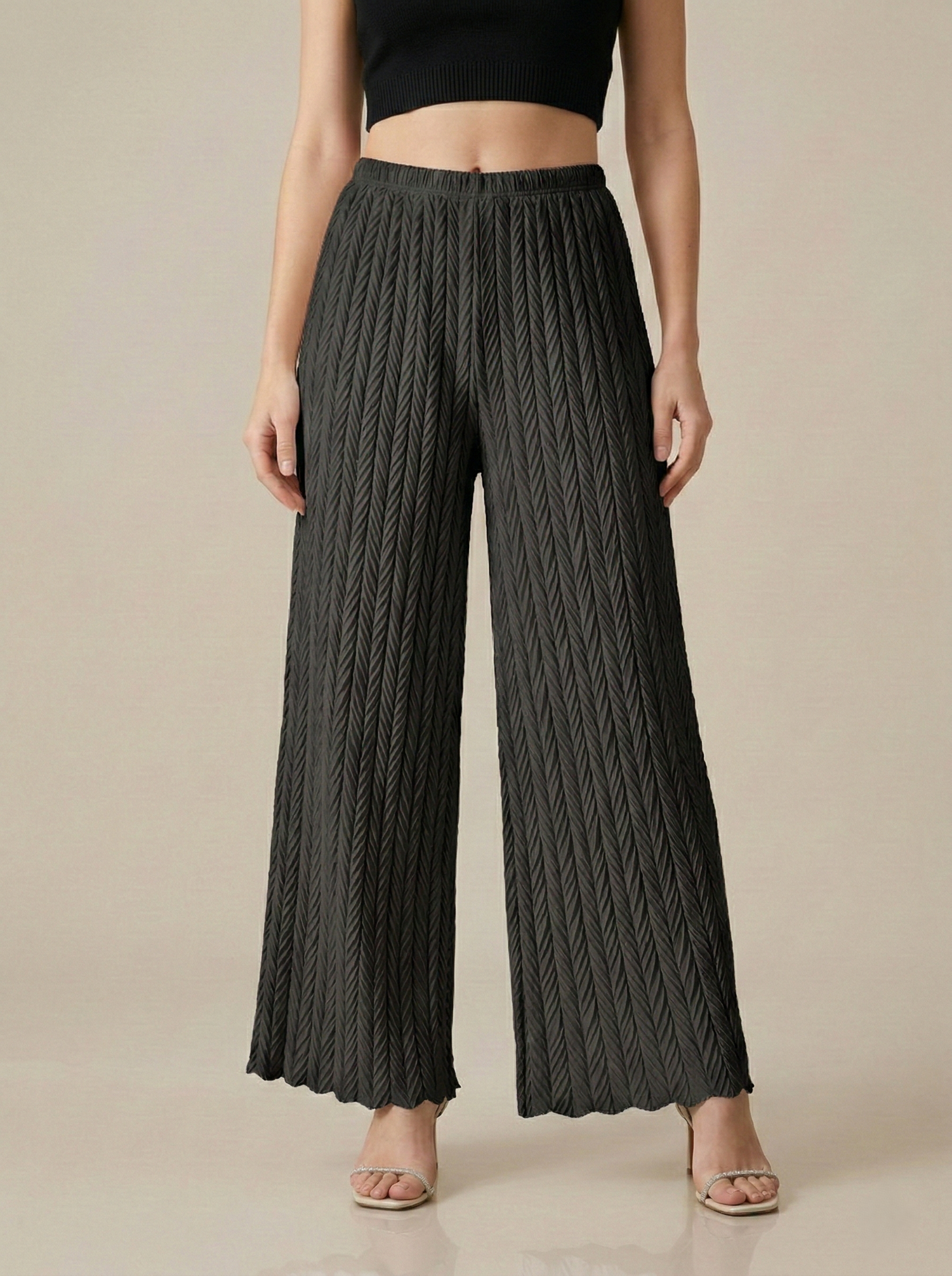 Textured pleated palazzo pants for women by Apricot Dione, featuring a comfortable wide-leg design in a stylish fabric.
