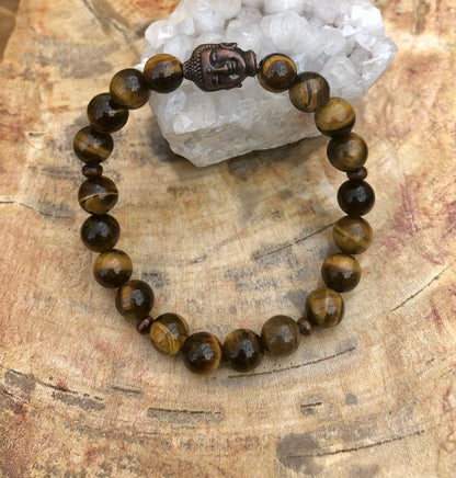 Tiger Eye &amp; Buddha gemstone bracelet by Violet Chaos featuring natural tiger eye beads and a Buddha charm.