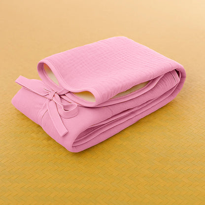 Pink Nomadic Changing Mat for kids and babies by Chocolate Briseis, featuring a soft, portable design ideal for on-the-go diaper changes.