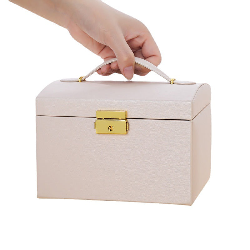 Leather jewelry box by Brown Demeter for organizing earrings and rings, with compartments for secure storage.