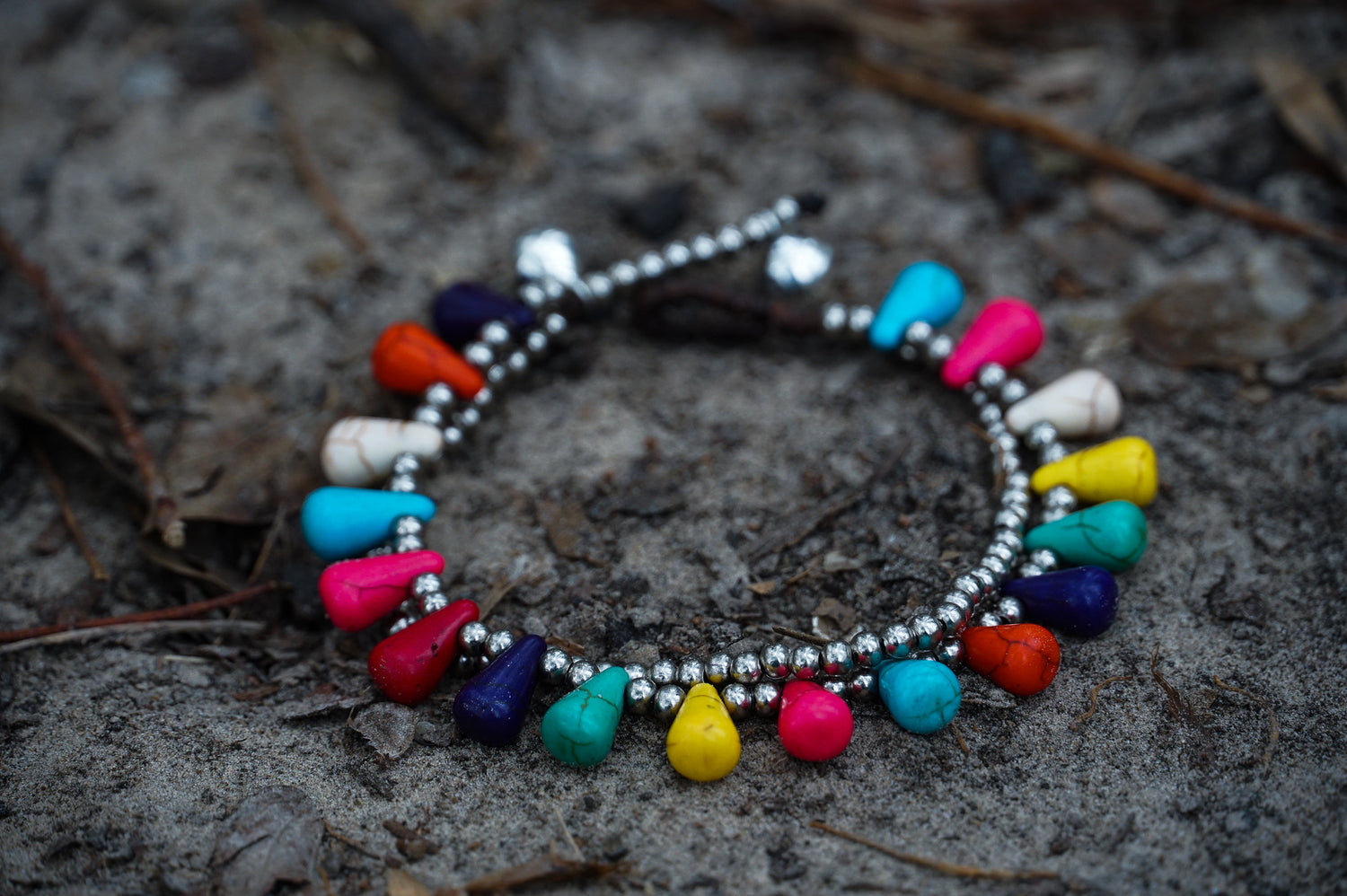 Silver boho double-stranded Ocean Drop bracelets by Tan Smokey featuring intricate silver bead and charm details.