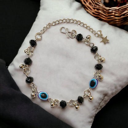Gray Poseidon Fortune’s Shield Evil Eye bracelet featuring a silver and blue beaded design with a protective evil eye charm.
