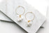 Indigo Jocasta Vita earrings featuring delicate gold hoops with intricate bead details, stylish and elegant jewelry accessory.
