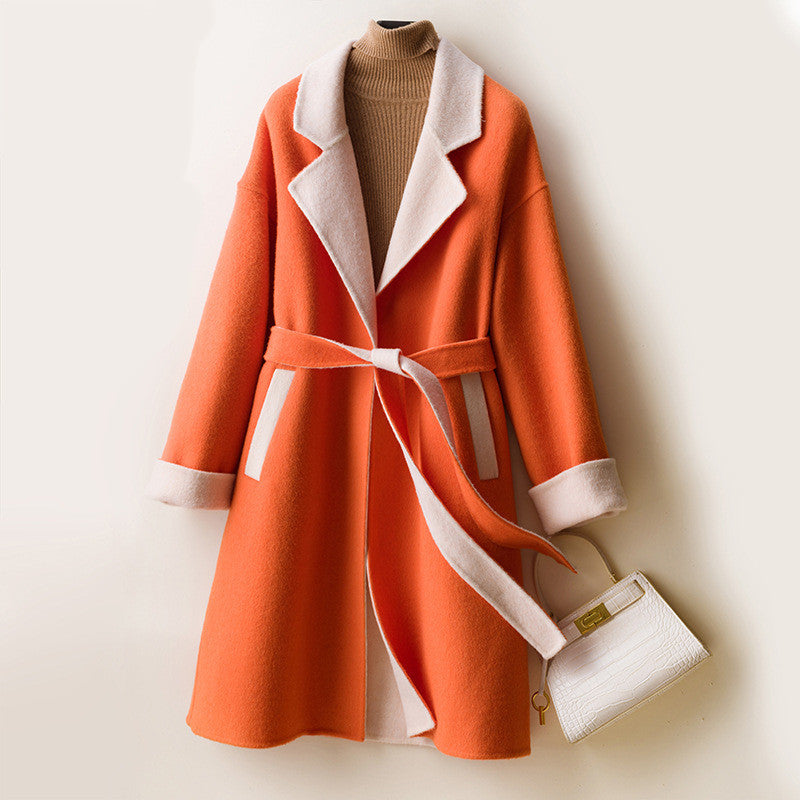 Ladies wool double-faced coat by Carmine Juneberry, showing the elegant, cozy coat with a classic design and warm wool fabric.