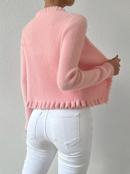 Carmine Juneberry Pearl Embrace Cardigan from Haute Edition 25, featuring a soft knit sweater with pearl details and a relaxed fit.
