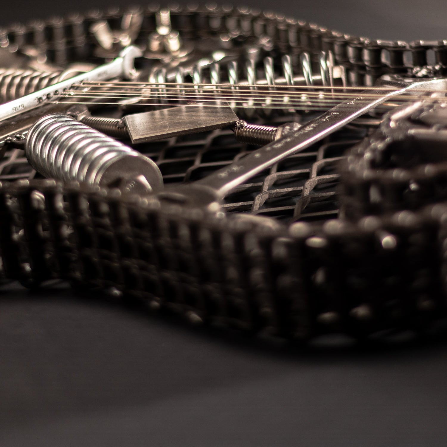 Metal electric guitar sculpture wall art by Turquoise Poppy, showcasing a heavy metal guitar design for home decor.
