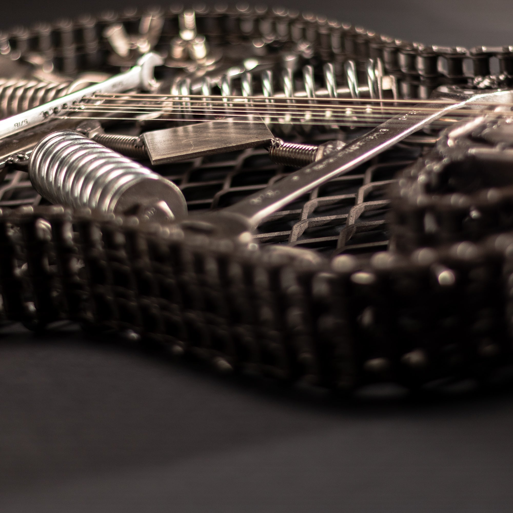 Metal electric guitar sculpture wall art by Turquoise Poppy, showcasing a heavy metal guitar design for home decor.