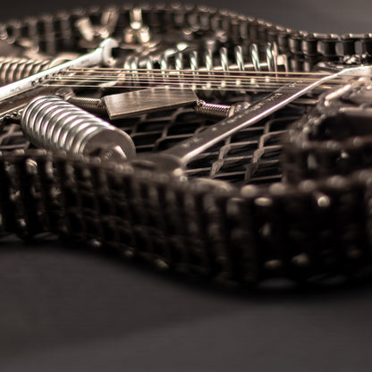 Metal electric guitar sculpture wall art by Turquoise Poppy, showcasing a heavy metal guitar design for home decor.