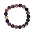Crimson Chaos amethyst bracelet featuring polished purple amethyst beads strung on a stretch cord, close-up of the jewelry.