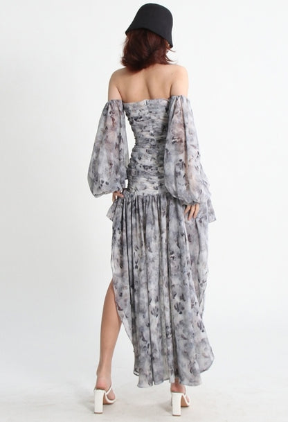 Mauve Ananke asymmetrical mini dress with slash neck and puff sleeves, solid minimalist design, showcased on a model.