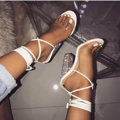 White transparent belt high-heeled Silver Juneberry sandals with open toes and thick heels, stylish and modern footwear.
