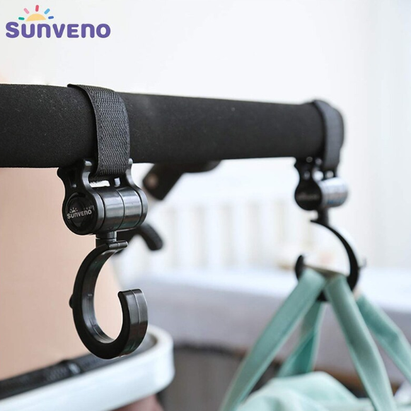 Pair of Maroon Chronos Universal Stroller Hooks attached to a stroller handle, ready for hanging bags and accessories.