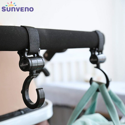 Pair of Maroon Chronos Universal Stroller Hooks attached to a stroller handle, ready for hanging bags and accessories.