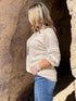 Ochre Ismene oatmeal lace detail sleeve top featuring delicate lace accents and a stylish, feminine design.