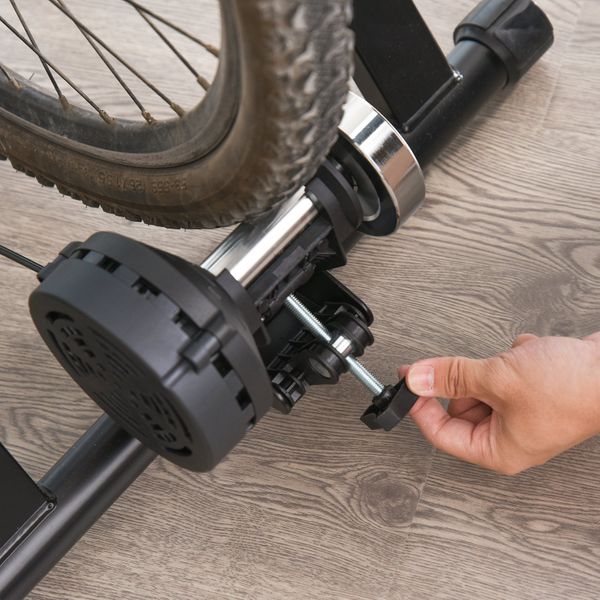 Soozier indoor magnetic bike trainer stand by Taupe Shadow with 5 resistance levels, showing the black and gray equipment setup